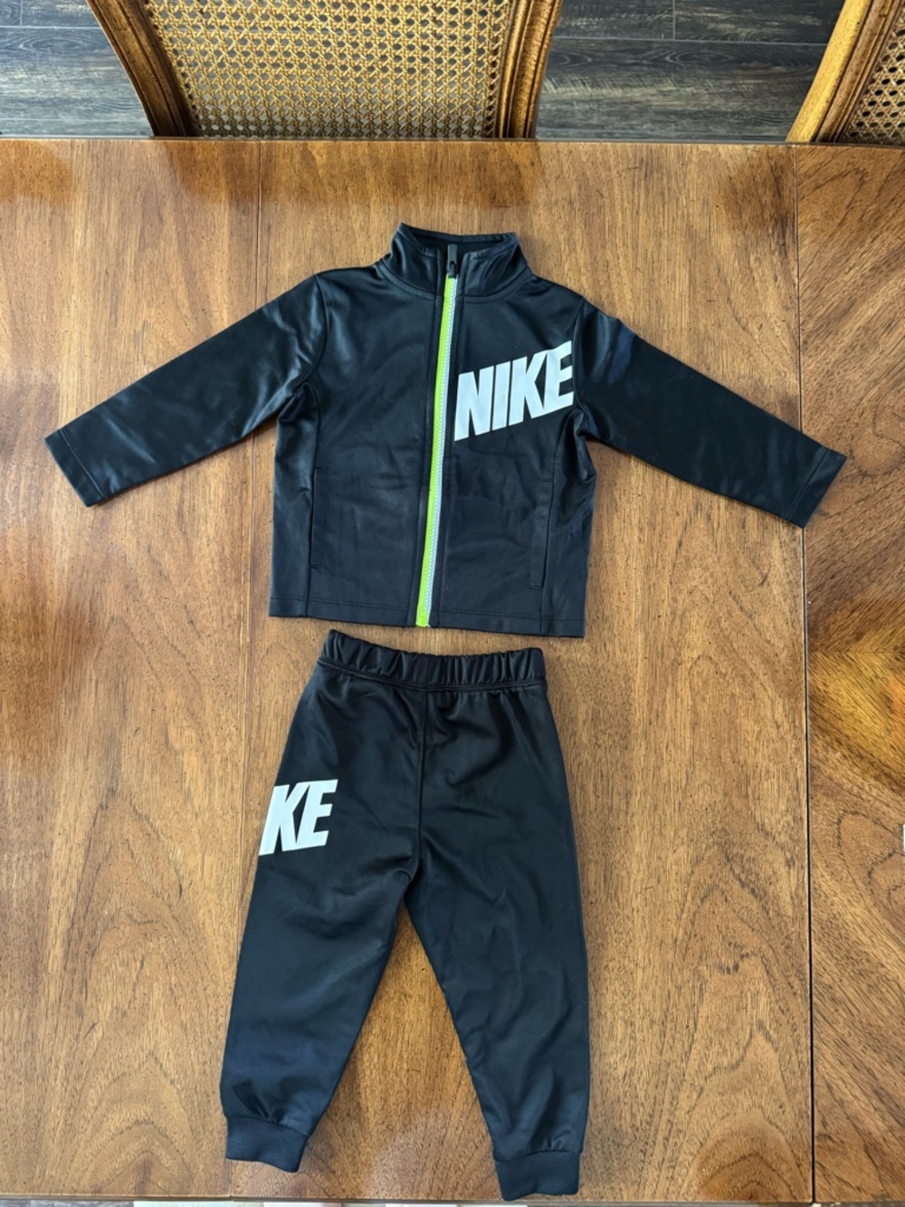 Nike Black Kids Tracksuit with Neon Green Zip Detail. Size 18m.